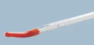 Close-up of a medical catheter with a specialized tiemann coudé tip